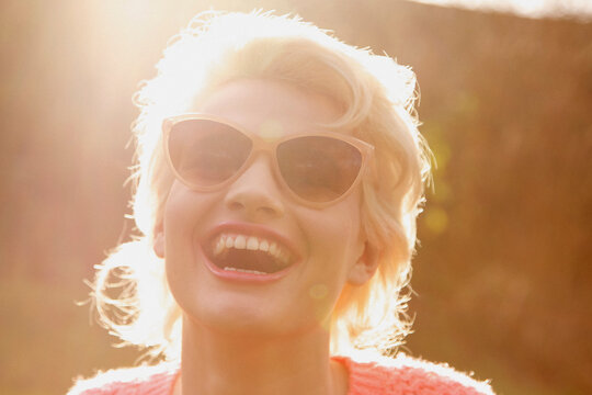 Smiling Young Woman Outdoors, Close-up View
