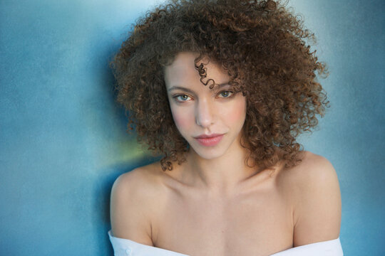 Portrait of Young Woman with Curly Hair
