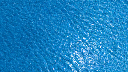 Nature of the beach and sea Summer with sunshine, sandy beaches, clear blue waters sparkling against the blue sky. On an island with good ecology and environment Background for summer vacation concept