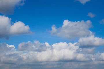 Beautiful blue sky with white clouds forming on sunny day