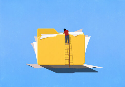 Man on ladder looking into large folder with messy paperwork spilling out
