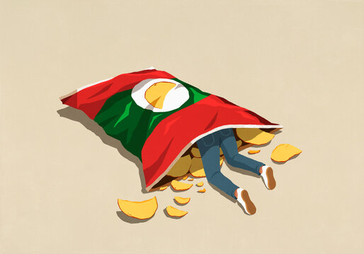 Man inside large potato chip bag
