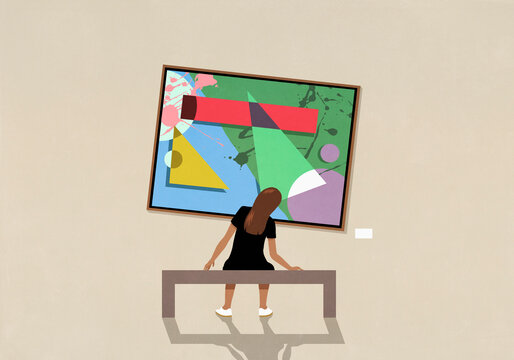 Woman leaning and looking at tilted abstract painting in museum
