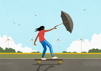 Woman with umbrella skateboarding in wind along rural wind turbines
