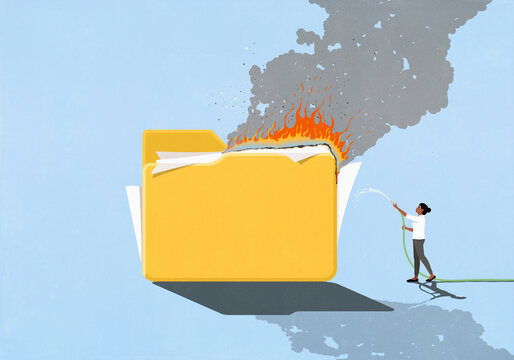 Woman with hose spraying water on burning file folder
