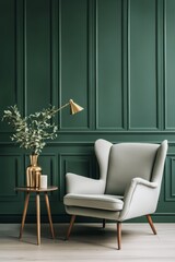 Elegant green accent wall with a stylish armchair and decorative table lamp