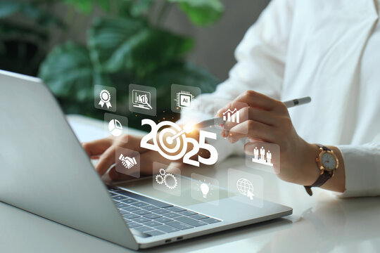 2025 New Year business goals concept. Woman touching target icon on virtual screen with 2025. planning strategies for success in achieving goals.Plans and Visions for Next Year 2025.business growth.