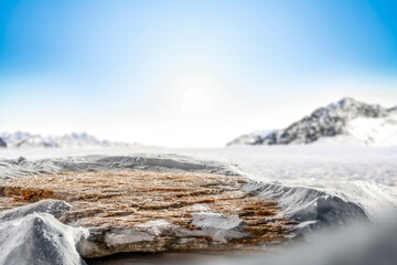 Winter mountain landscape and snow covered ground with copy space for products.