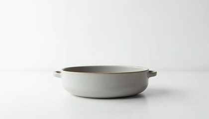 Minimalist earthenware casserole centered, highlighting its handmade design for advertising.


