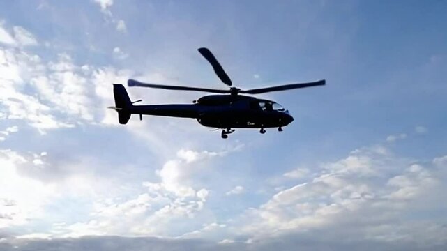 Helicopter Flying in the Sky &ndash; Aerial Transportation, Aviation Footage, and Travel Concept Video with Blue Cloudy Background