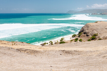 Turquoise blue ocean from the dry land