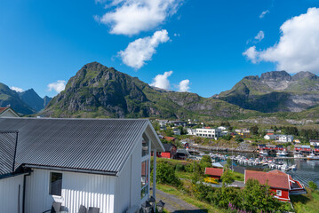 Panoramic view with fishing port and surrounding mountain landscape. Sorvagen in Lofoten district...