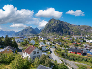 Obraz premium Aerial view, villagescape of Sorvagen in middle of rugged landscape. Lofoten district in Norway