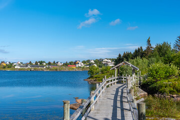 Obraz premium Wooden footbridge on hiking trail around Lake Sorvagvatnet near Sorvagen. Lofoten district in Norway