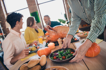 Photo of happy family celebrate thanksgiving sit table communicate holiday dinner relatives living room celebrate weekend