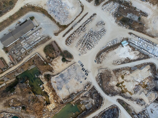 Aerial view of a marble quarry in Vila Viçosa, Alentejo, showcasing expansive stone extraction areas and stunning natural landscapes, ideal for commercial and artistic projects.