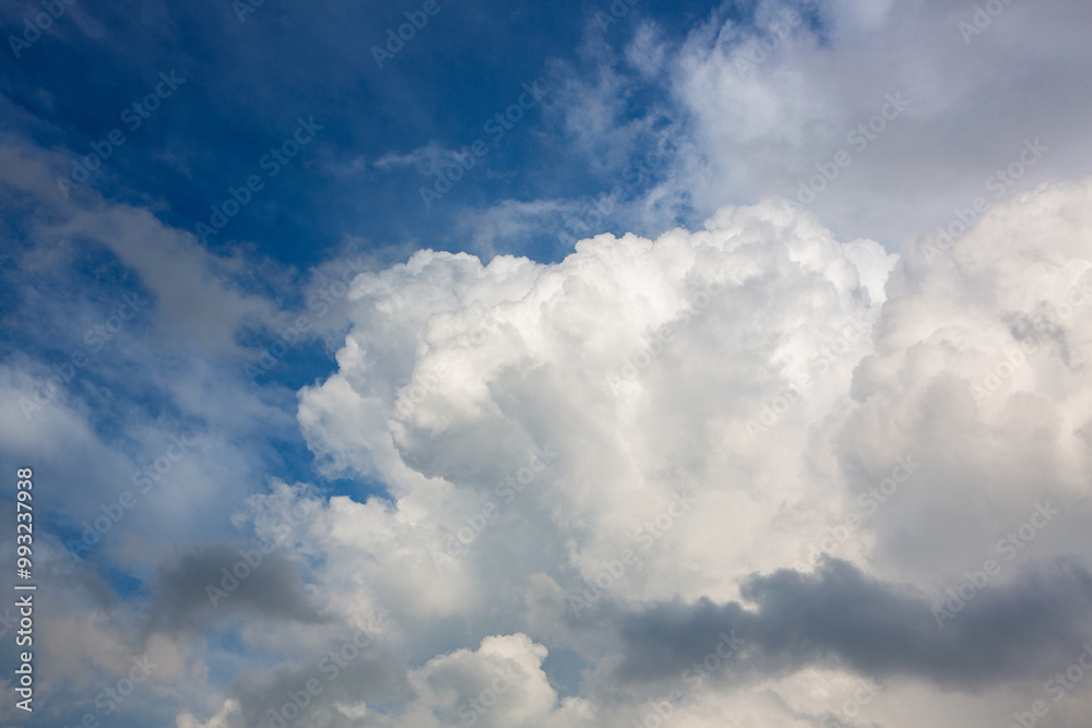 Wall mural cloudy sky panorama featuring large cumulonimbus clouds, illustrating climate change effects on weat