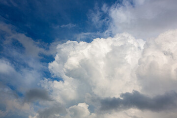 Cloudy sky panorama featuring large cumulonimbus clouds, illustrating climate change effects on weather patterns
