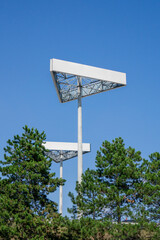Two Triangle advertising banners, triangle billboard mock up near shopping center SCS near Vienna and highway