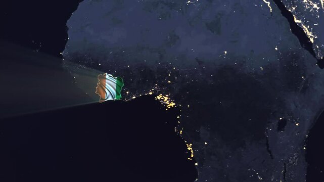 Realistic Digital Earth Night Orbit and Zoom Shining Country Flag Embedded in Borders Ivory Coast
