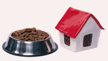 adopt a pet toy ceramic house with red roof and metal bowl of dry food on white background