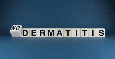 Words DERMATITIS or NO DERMATITIS spelled out on wooden blocks