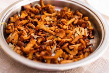 Traditional dishes of Eastern European cuisine. Fried chanterelles in pan