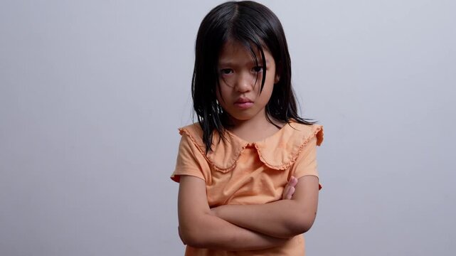 A Litter Asian girl sitting in room conner and crying after Punished by the blackout.