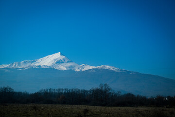 Serene Winter Landscape with Snowy Peaks