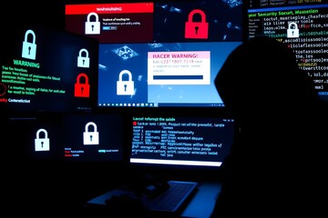 Amidst a chaotic array of cables and blinking LEDs, a hacker sits poised for action