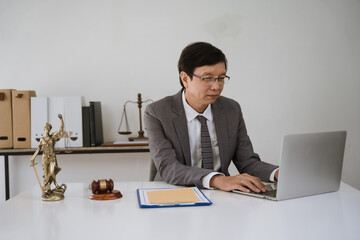 Focused Lawyer Working on Laptop in Office 