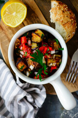 Spicy Grilled Eggplant Salad in a  bowl .top veiw