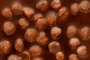 Chocolate bar with hazelnuts texture background. Dark chocolate with nuts. Wallpaper, Pattern