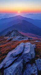 Obraz premium Panoramic view of mountain range during autumn sunrise