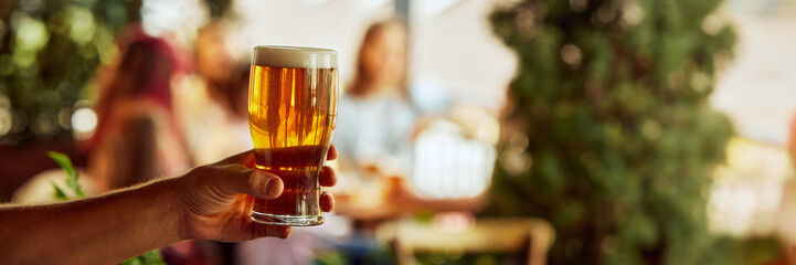 Banner. Moment final whistle blows, fans raise their drinks high, celebrating intense highs and unforgettable emotions of game. Concept of Oktoberfest, brewery, vacation, Friday mood.