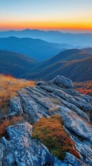 Fototapeta premium Panoramic view of mountain range during autumn sunrise