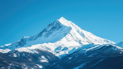 Snow-covered mountain peak under a clear blue sky, offering ample space for text or message. No people, serene winter scene