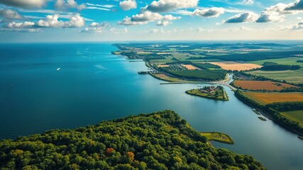 Fototapeta premium A serene landscape depicts the outline of Holland's stunning coastline with rolling hills, lush green forests, and picturesque canals slowly converging into the North Sea.
