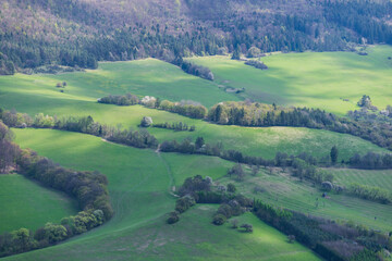 Bird's-eye view on green meadow in Sulov rocks