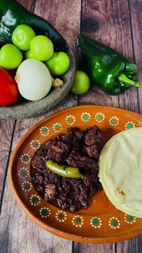 Dish full of moronga or blood sausage, with tortillas, a typical food from Mexico, Central America and Latin America made with rice, spices and pig's blood.