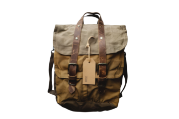 Versatile canvas and leather backpack with stylish design and tag