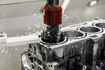 Work of Cylinder honing engine machine. Diamond boring of car details on CNC machine.