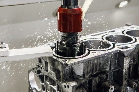Work of Cylinder honing engine machine. Diamond boring of car details on CNC machine.