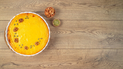 Homemade Thanksgiving Pumpkin Pie on a wooden background. top view. copy space