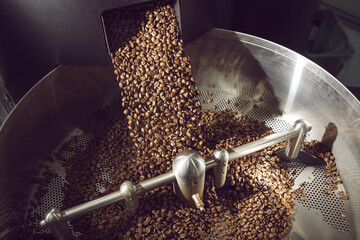 Freshly Roasted Coffee Beans Unloading Into Rotating Cooling Drum