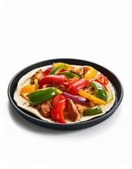 Delicious Fajita with Peppers and Onions on a Tortilla in a Black Skillet