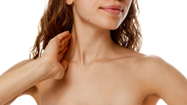 Cropped photo of young woman's neckline with soft, smooth, toned skin against white studio background. Concept of beauty treatment, fashion, appearance, self care, spa procedures. Ad