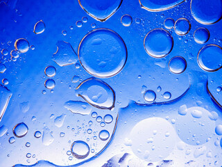 Bubbles on blue background. Abstract oxygen bubble water in sea sponge on blue background.Blue circle bubble water