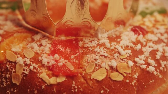 Traditional spanish round cake Roscon de Reyes with fruit and nuts.