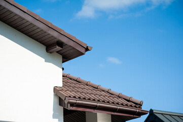 roof with black tile. modern roof tiles of metal. modern building in the city